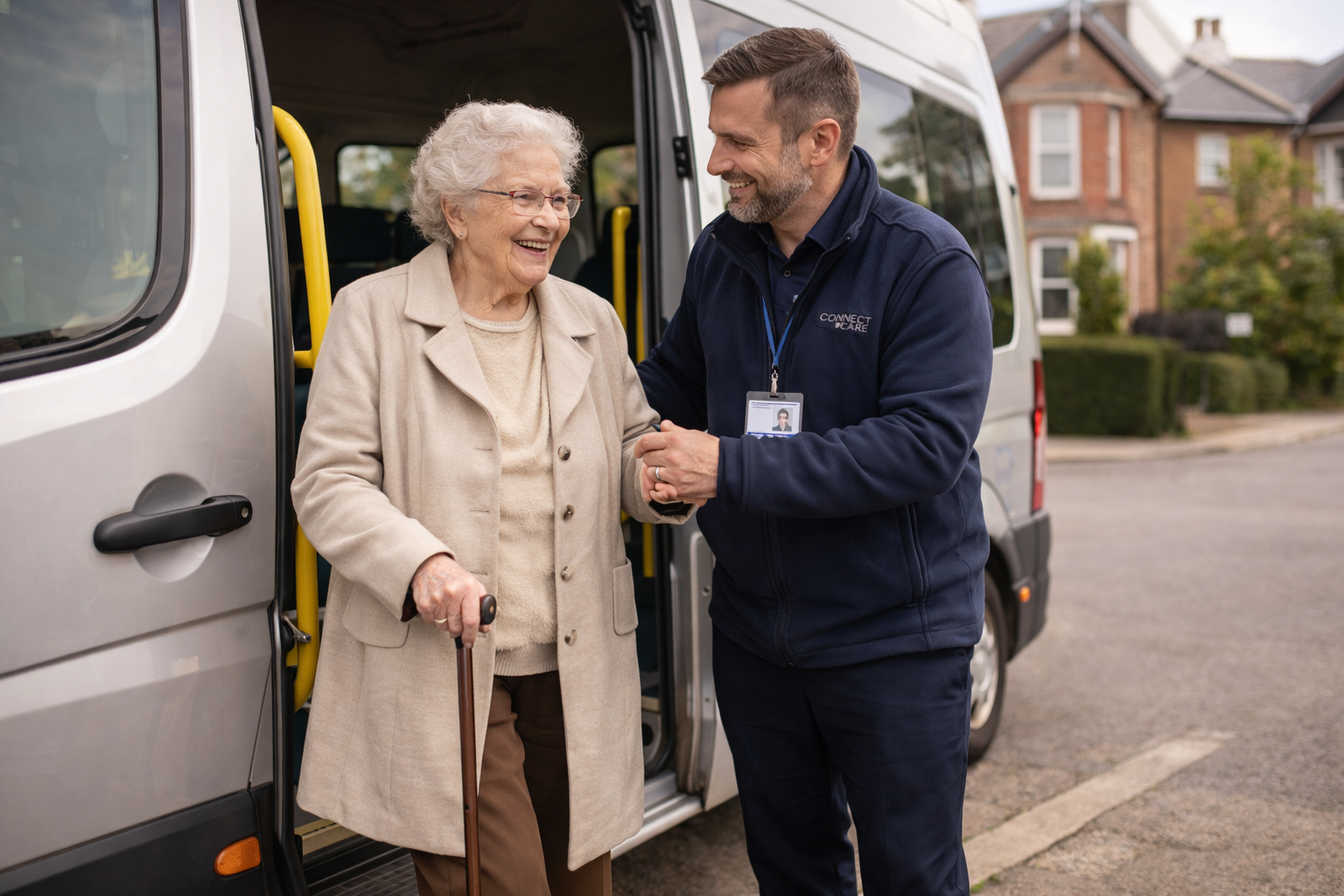 Driver helping elderly lady from minibus